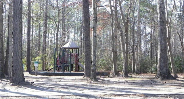 view of property's community with a playground