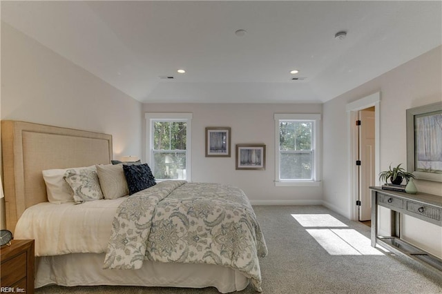 carpeted bedroom with vaulted ceiling