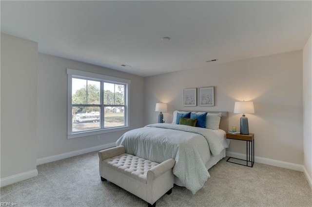 bedroom with light carpet