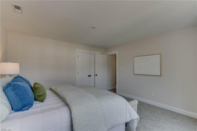 bedroom with a closet and carpet floors