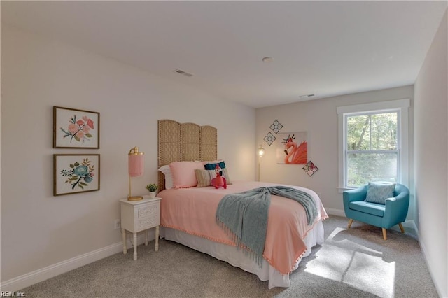 bedroom with light colored carpet