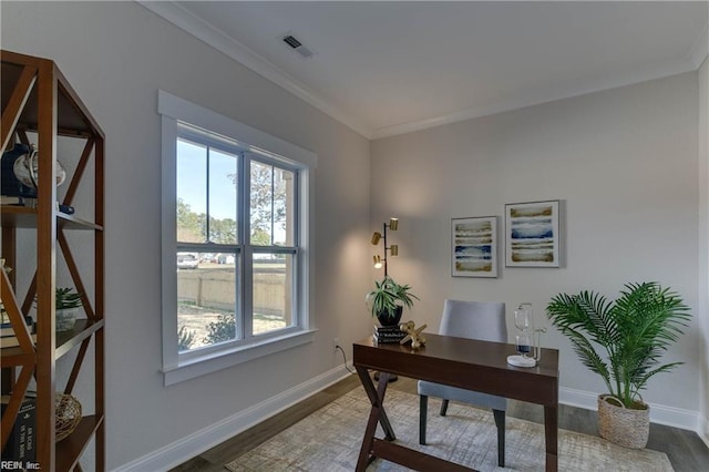 home office with wood-type flooring and crown molding