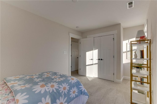 carpeted bedroom featuring a closet