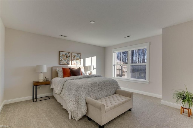 bedroom with light colored carpet