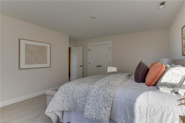 bedroom with carpet floors and a closet