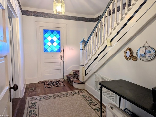 entrance foyer with dark hardwood / wood-style flooring