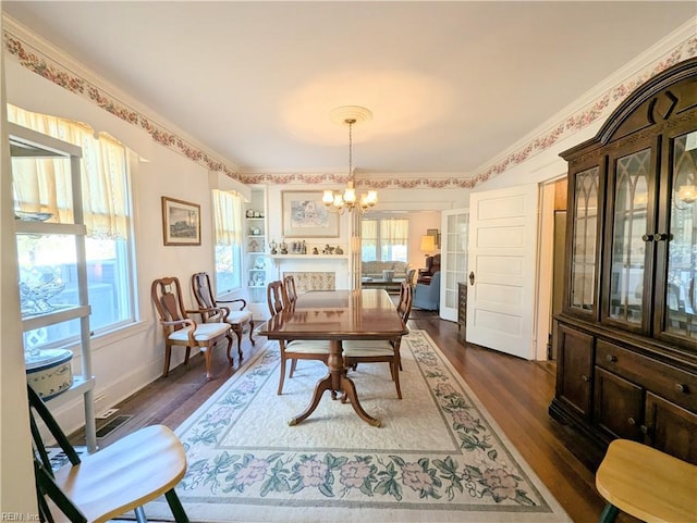 dining room featuring a notable chandelier and dark hardwood / wood-style floors