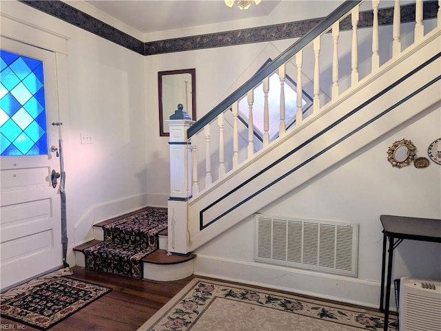 entryway with wood-type flooring