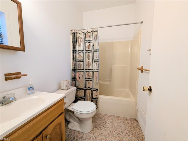 full bathroom with vanity, toilet, and shower / bath combo with shower curtain