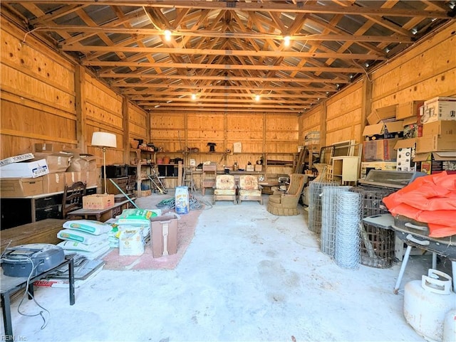 garage featuring wood walls