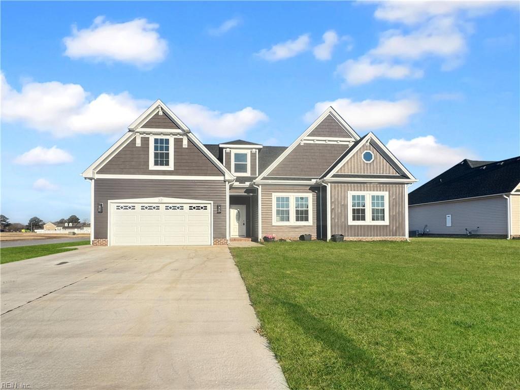 craftsman-style home with a front yard and a garage