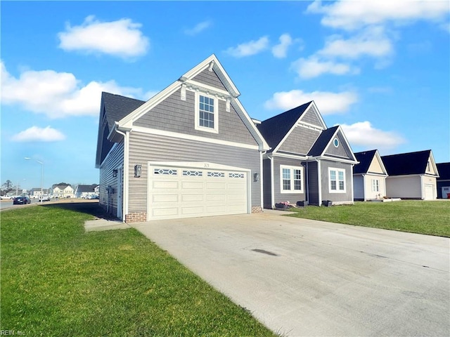 view of front of property with a front lawn and a garage