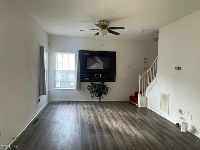 unfurnished living room with ceiling fan and dark hardwood / wood-style flooring