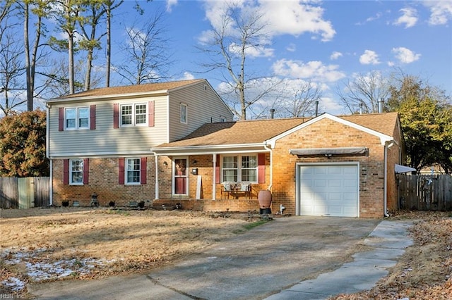 view of front of property featuring a garage, covered porch, fence, and brick siding