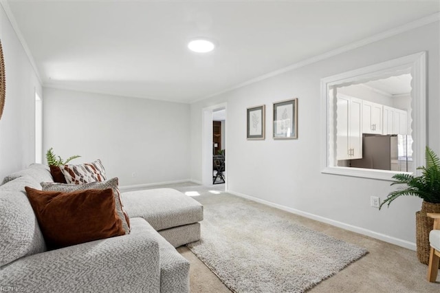 living room with light carpet, ornamental molding, and baseboards