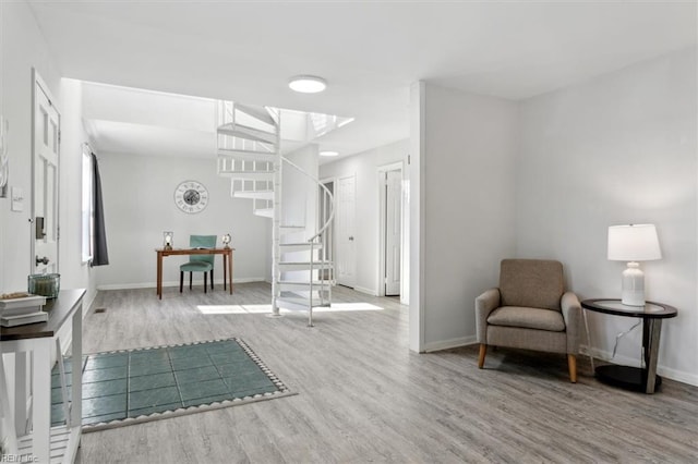 living area with light hardwood / wood-style floors