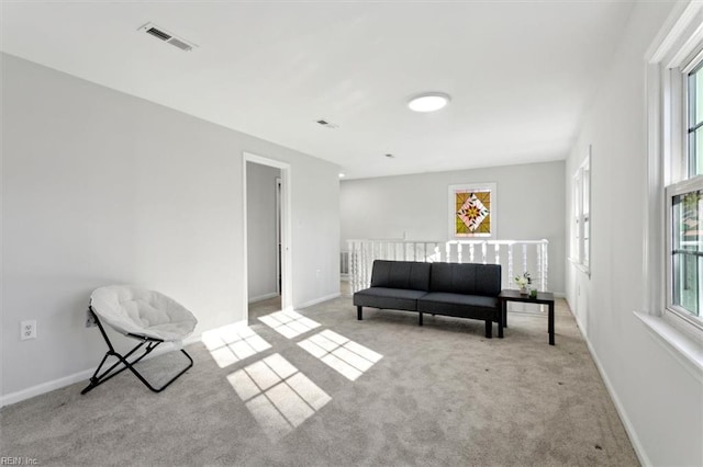 sitting room featuring carpet, visible vents, and baseboards