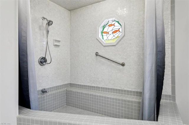 full bath with tiled shower