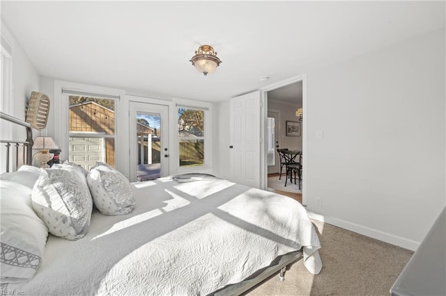 bedroom featuring carpet flooring and access to outside