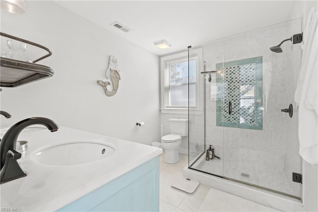 bathroom featuring toilet, tile patterned flooring, walk in shower, and vanity