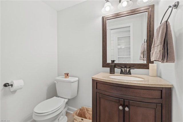 bathroom featuring toilet and vanity