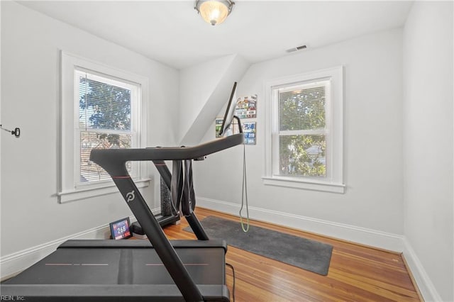 workout area featuring hardwood / wood-style floors