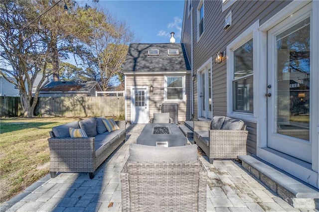 view of patio with an outdoor hangout area and an outbuilding