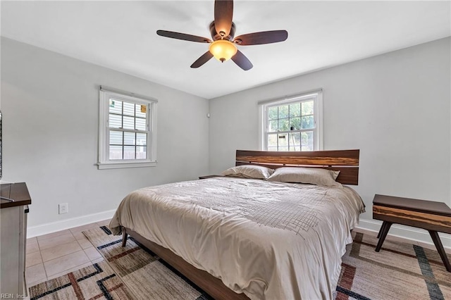 tiled bedroom with ceiling fan