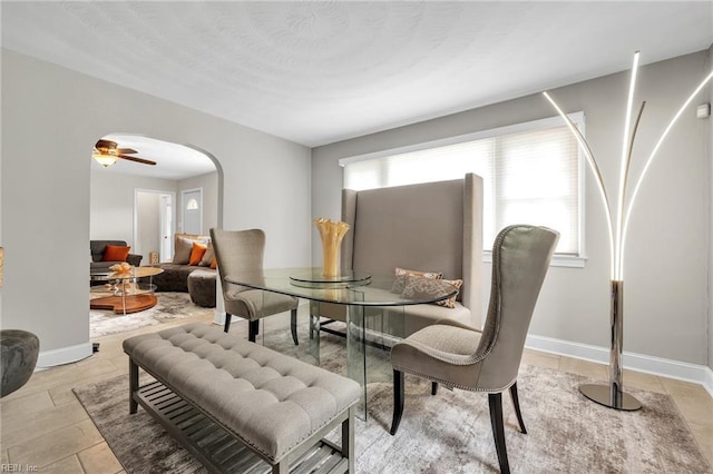 dining room featuring ceiling fan