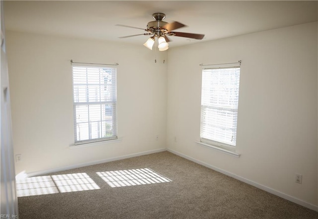 empty room featuring carpet flooring and ceiling fan