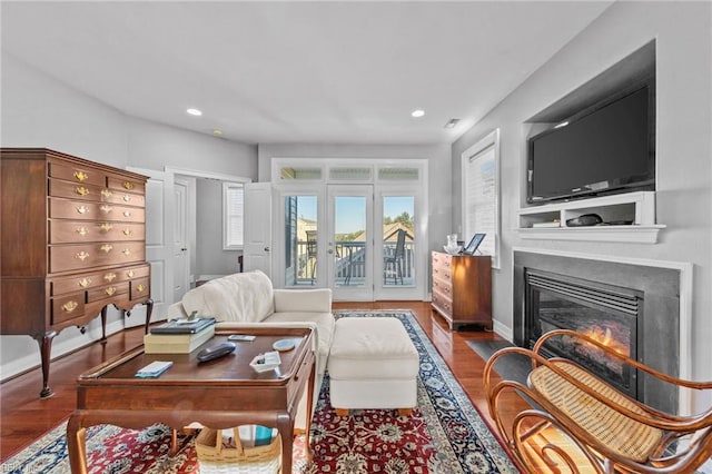 living room with hardwood / wood-style floors and french doors