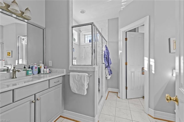 bathroom featuring vanity and an enclosed shower