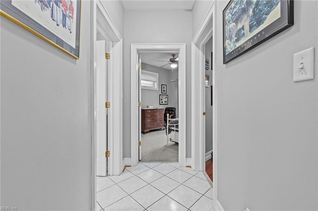 hallway with light tile patterned flooring