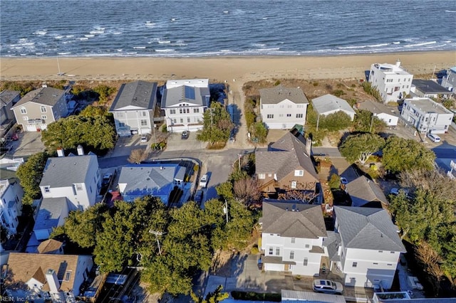 aerial view featuring a water view and a beach view