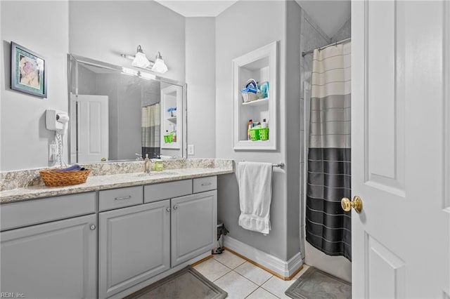 bathroom featuring tile patterned flooring and vanity