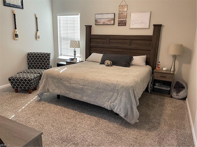 bedroom featuring carpet floors and baseboards