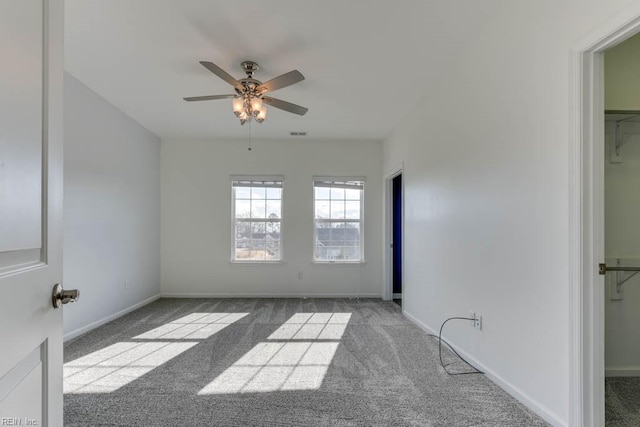 spare room with light carpet and ceiling fan