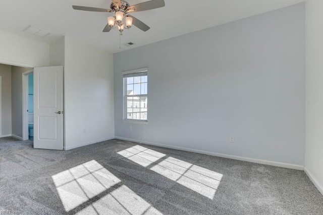 carpeted empty room featuring ceiling fan