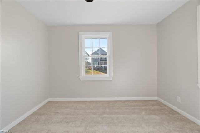 empty room with light colored carpet