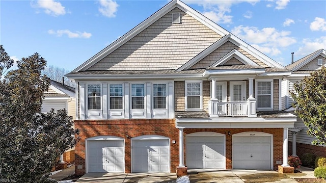 view of front of home featuring a garage and a balcony