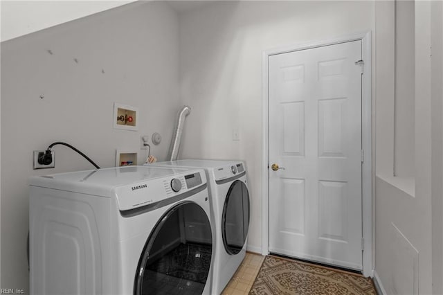 washroom with independent washer and dryer