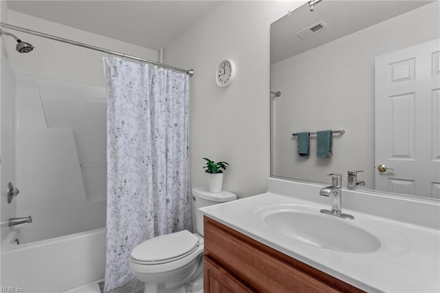 full bathroom featuring shower / tub combo, vanity, and toilet