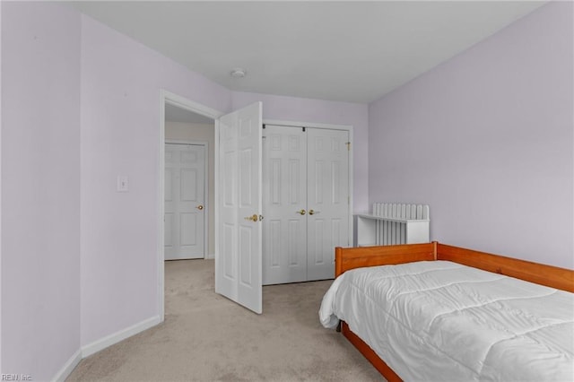 carpeted bedroom with a closet