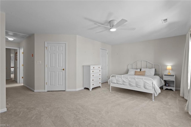 bedroom featuring ceiling fan and light carpet