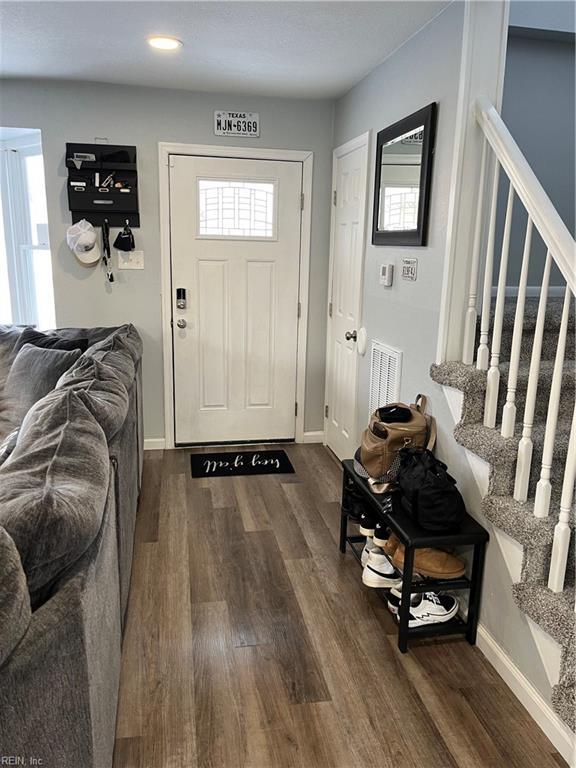 entrance foyer featuring dark wood-type flooring