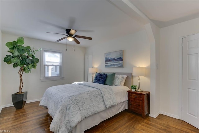 bedroom featuring ceiling fan and dark hardwood / wood-style flooring