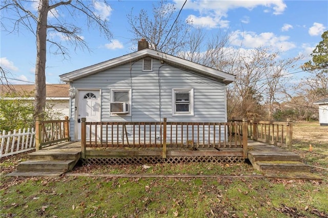 back of house with cooling unit and a deck