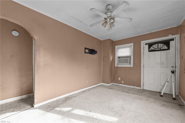 unfurnished room featuring ceiling fan and cooling unit