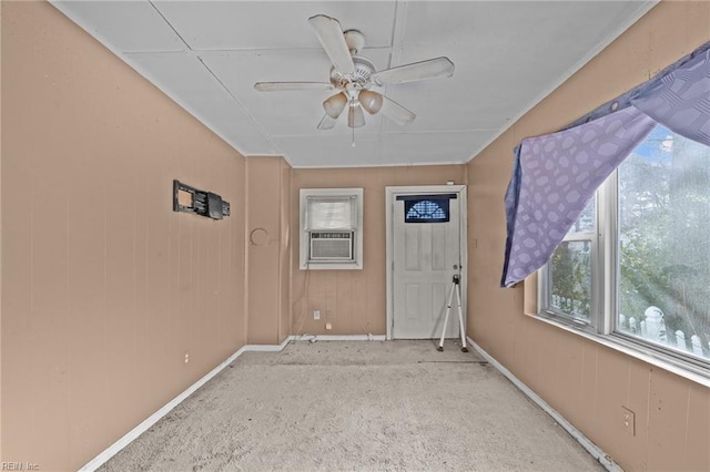 spare room featuring ceiling fan and cooling unit