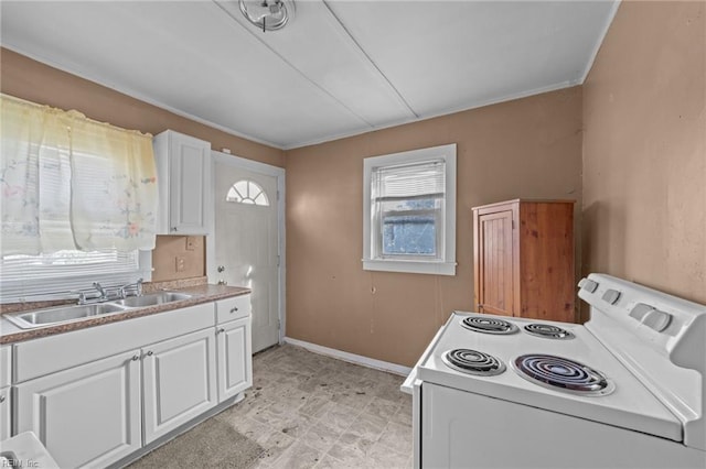 kitchen featuring white cabinetry, sink, and white electric stove